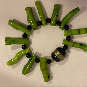 Bracelet with green tree branch coral and lava beads.